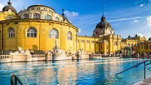 Outdoor thermal pool at Széchenyi Baths with neo-baroque architecture